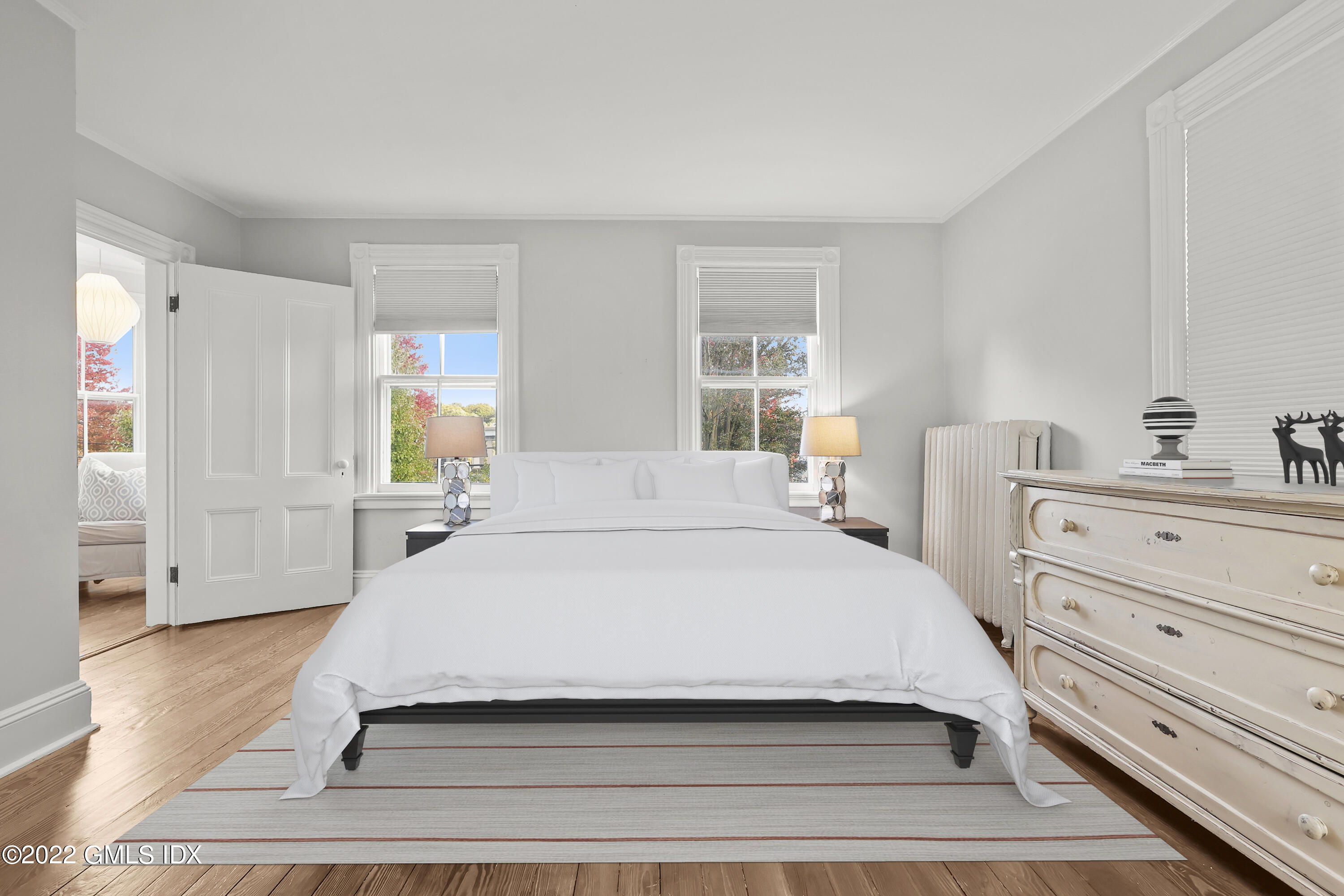 60 River Road Cos Cob, CT 06807 - Photo 14 of 31 a spacious bedroom with a bed and a window