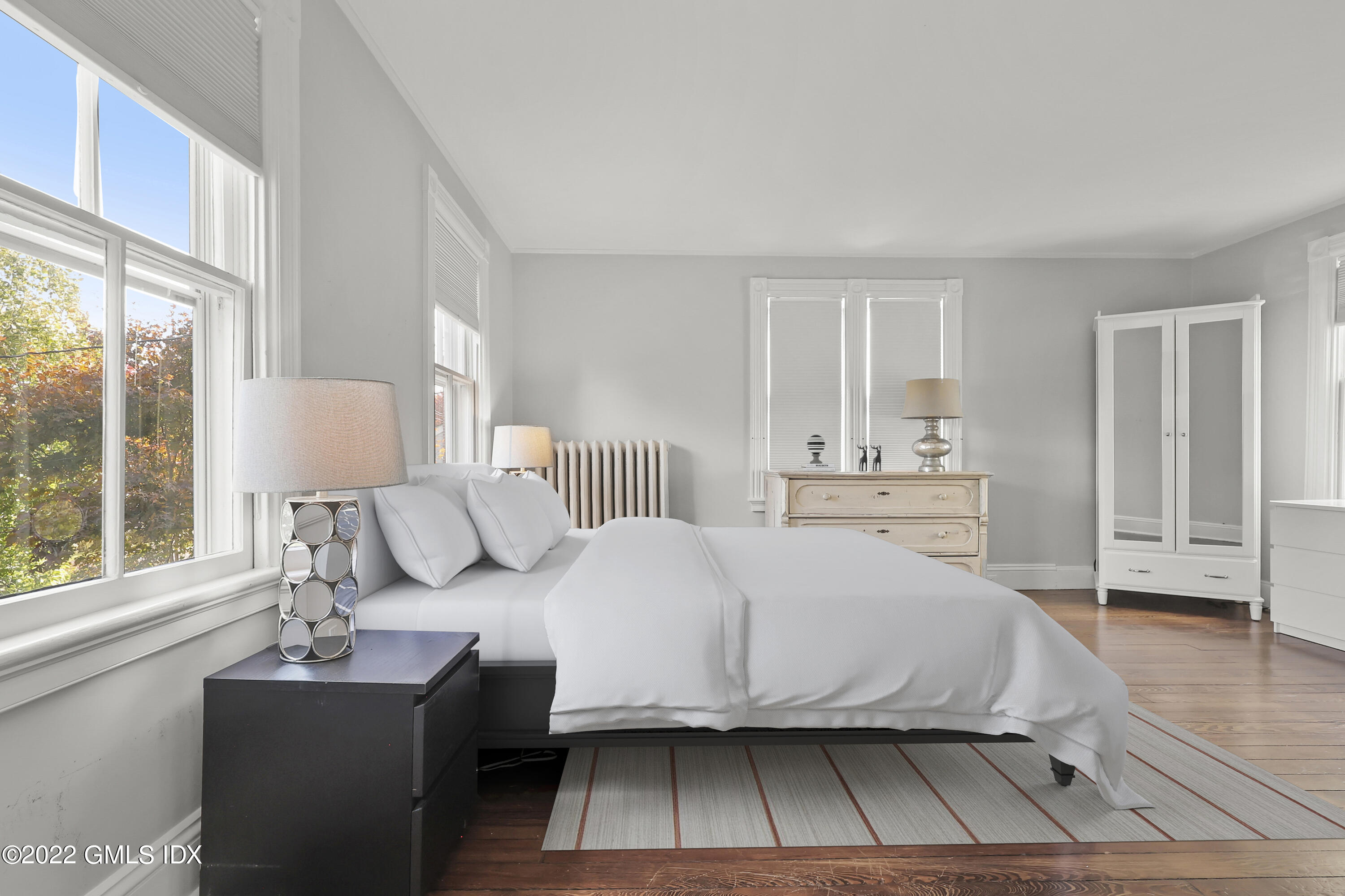 60 River Road Cos Cob, CT 06807 - Photo 15 of 31 a bedroom with a bed window and a table