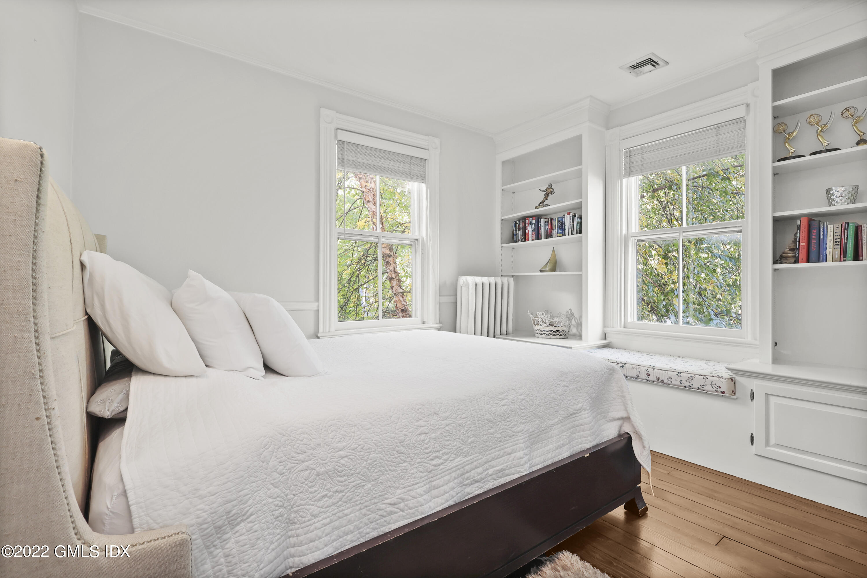 60 River Road Cos Cob, CT 06807 - Photo 18 of 31 a bedroom with a bed and a large window