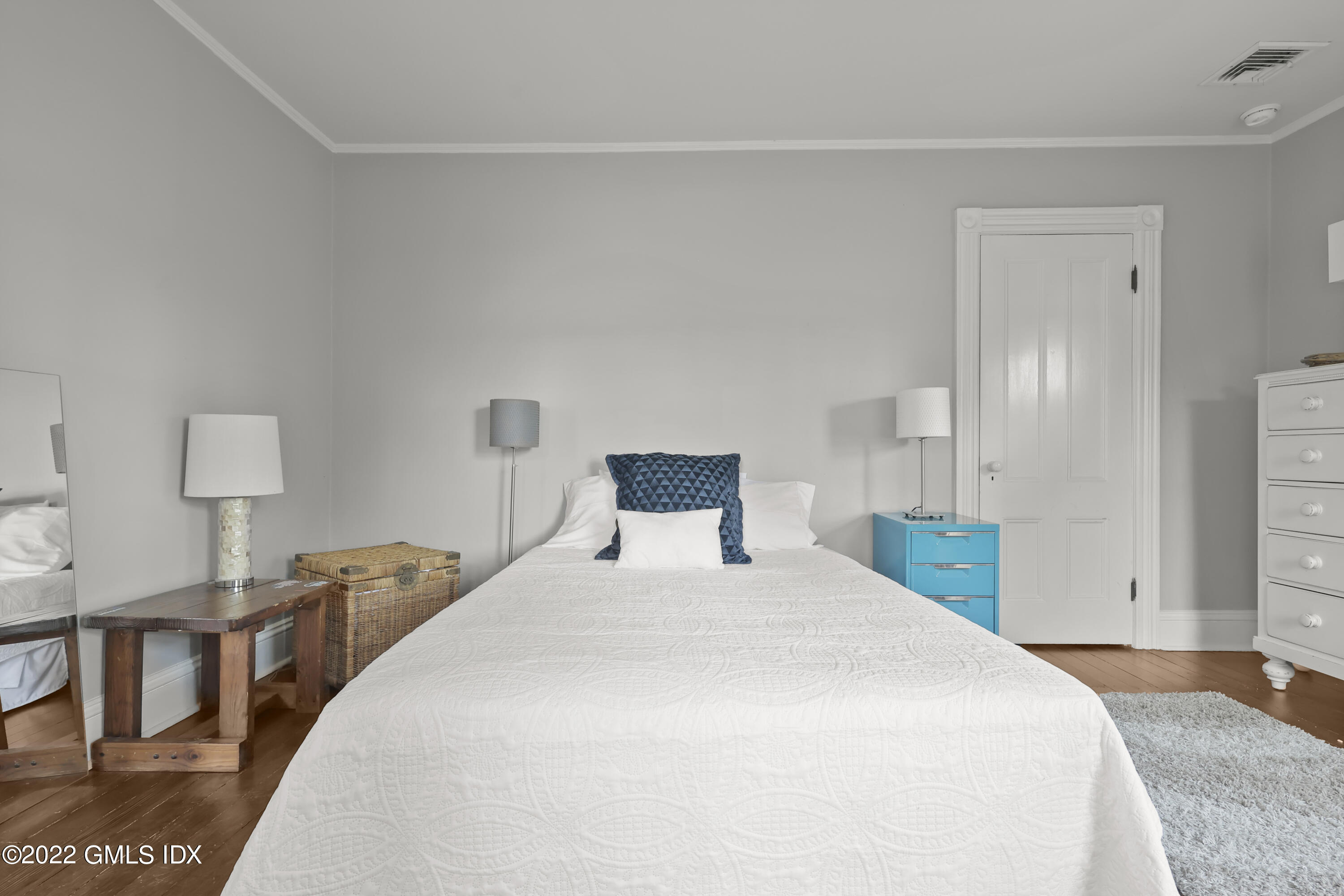 60 River Road Cos Cob, CT 06807 - Photo 20 of 31 a bedroom with a bed and wooden floor