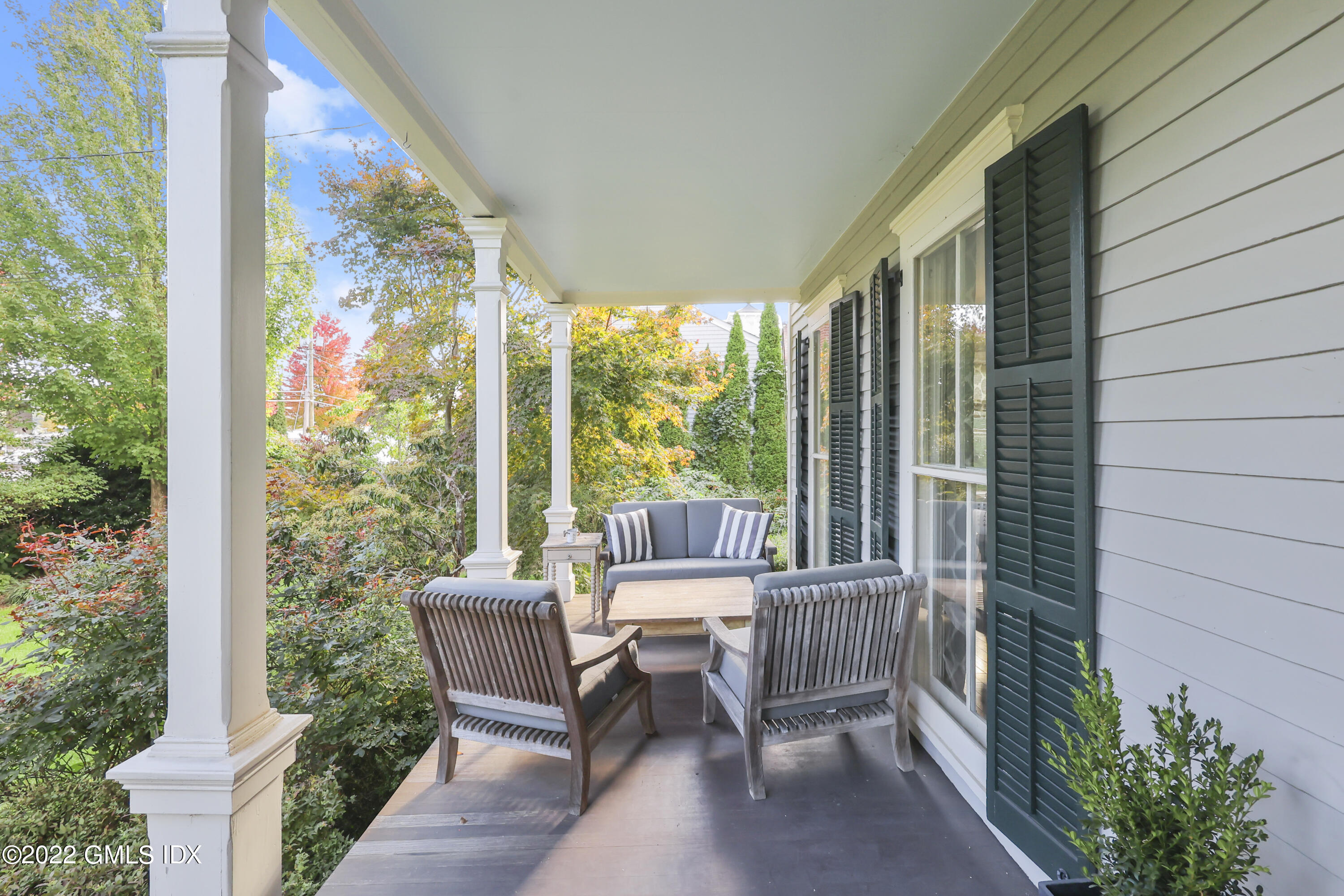 60 River Road Cos Cob, CT 06807 - Photo 2 of 31 a balcony with couple of chairs and a couch
