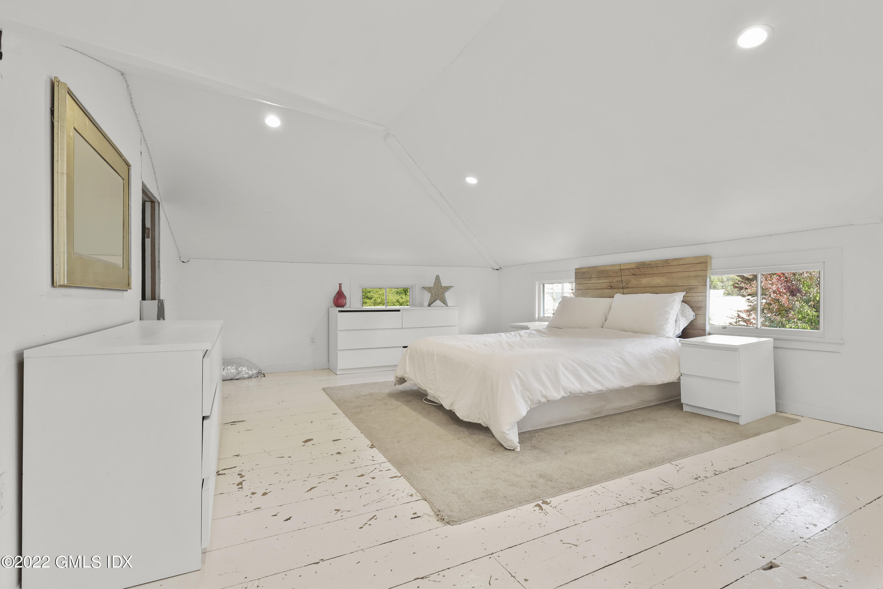 60 River Road Cos Cob, CT 06807 - Photo 22 of 31 a bedroom with a bed and a cabinets