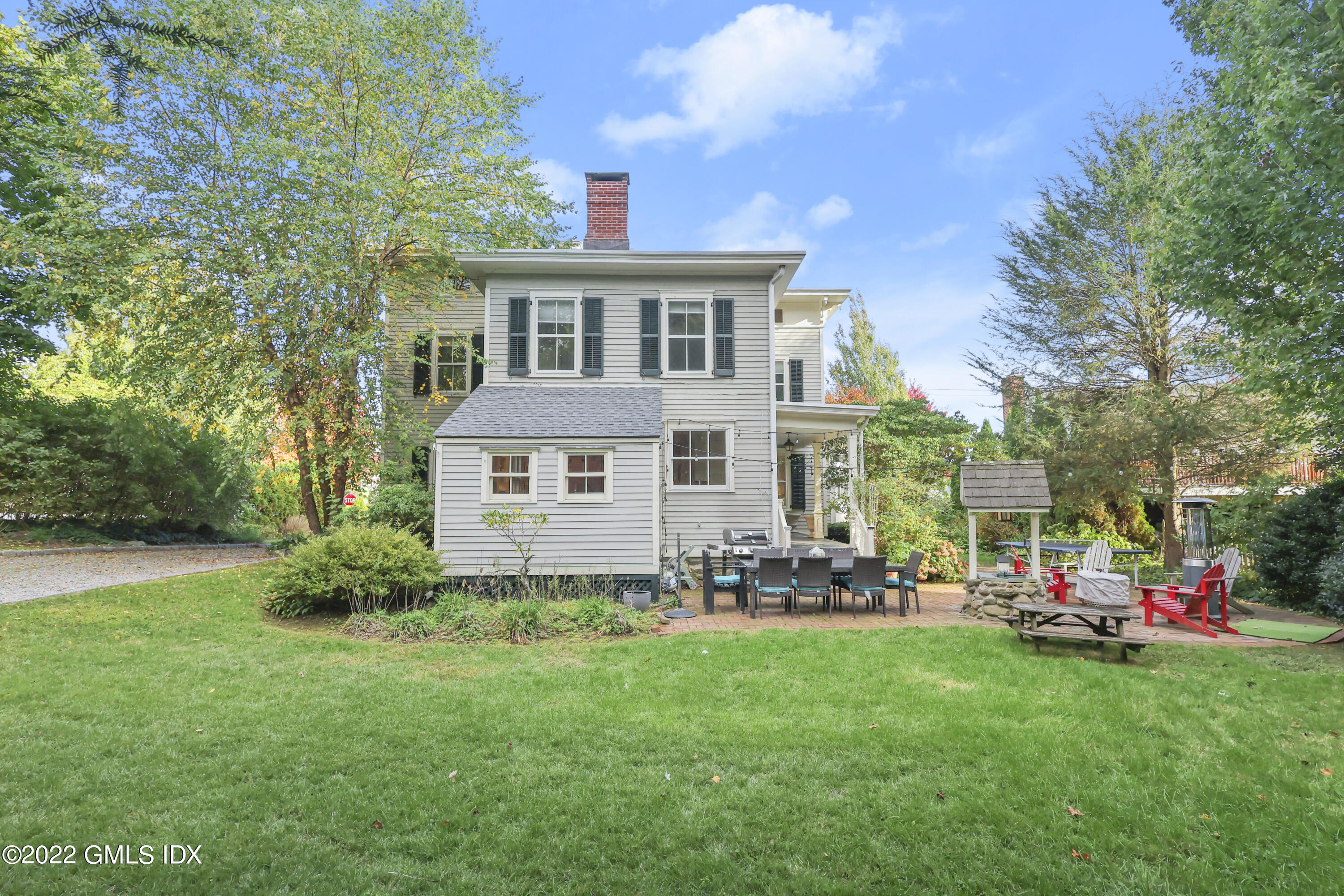 60 River Road Cos Cob, CT 06807 - Photo 30 of 31 a front view of house with yard and outdoor seating
