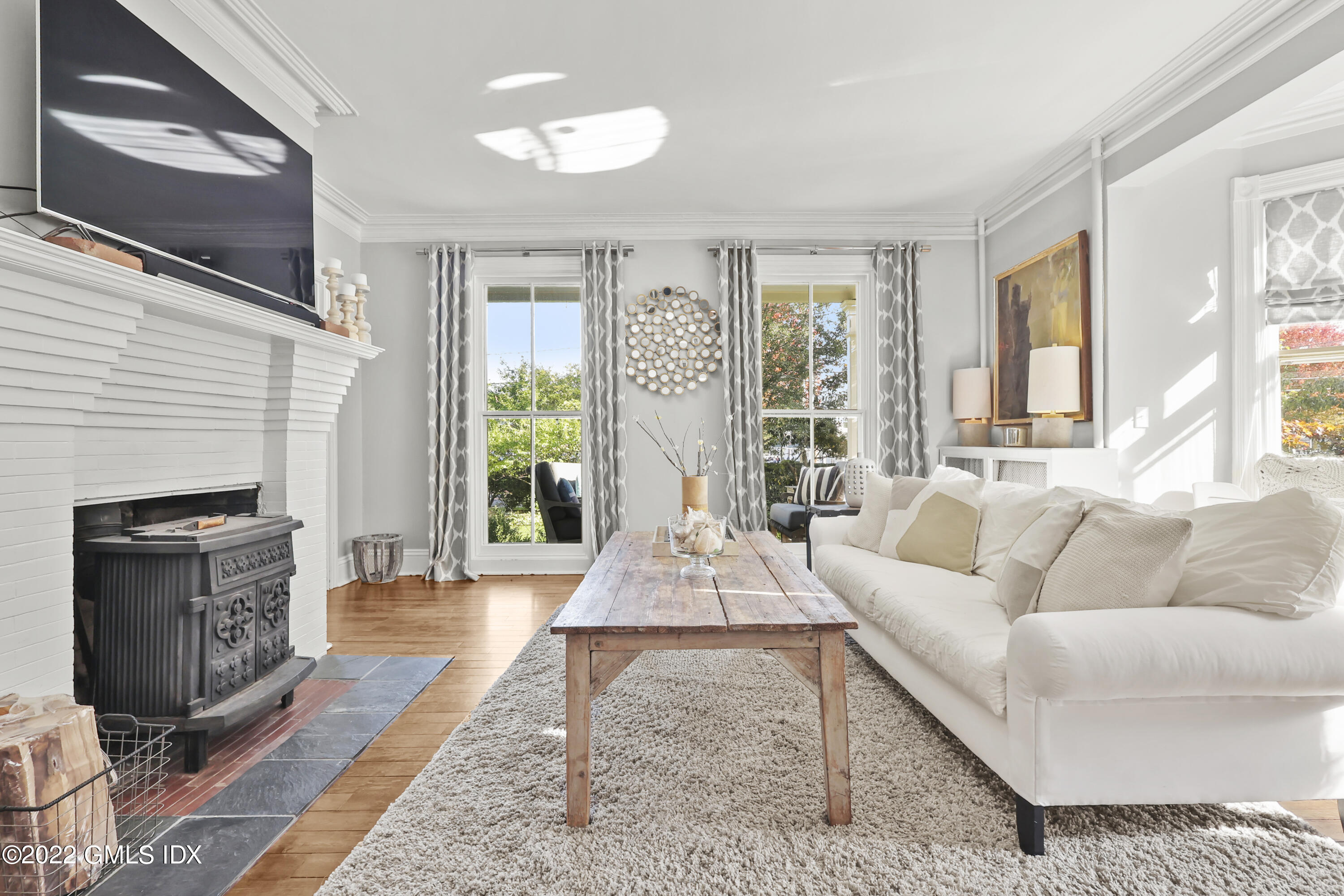 60 River Road Cos Cob, CT 06807 - Photo 4 of 31 a living room with furniture and a fireplace