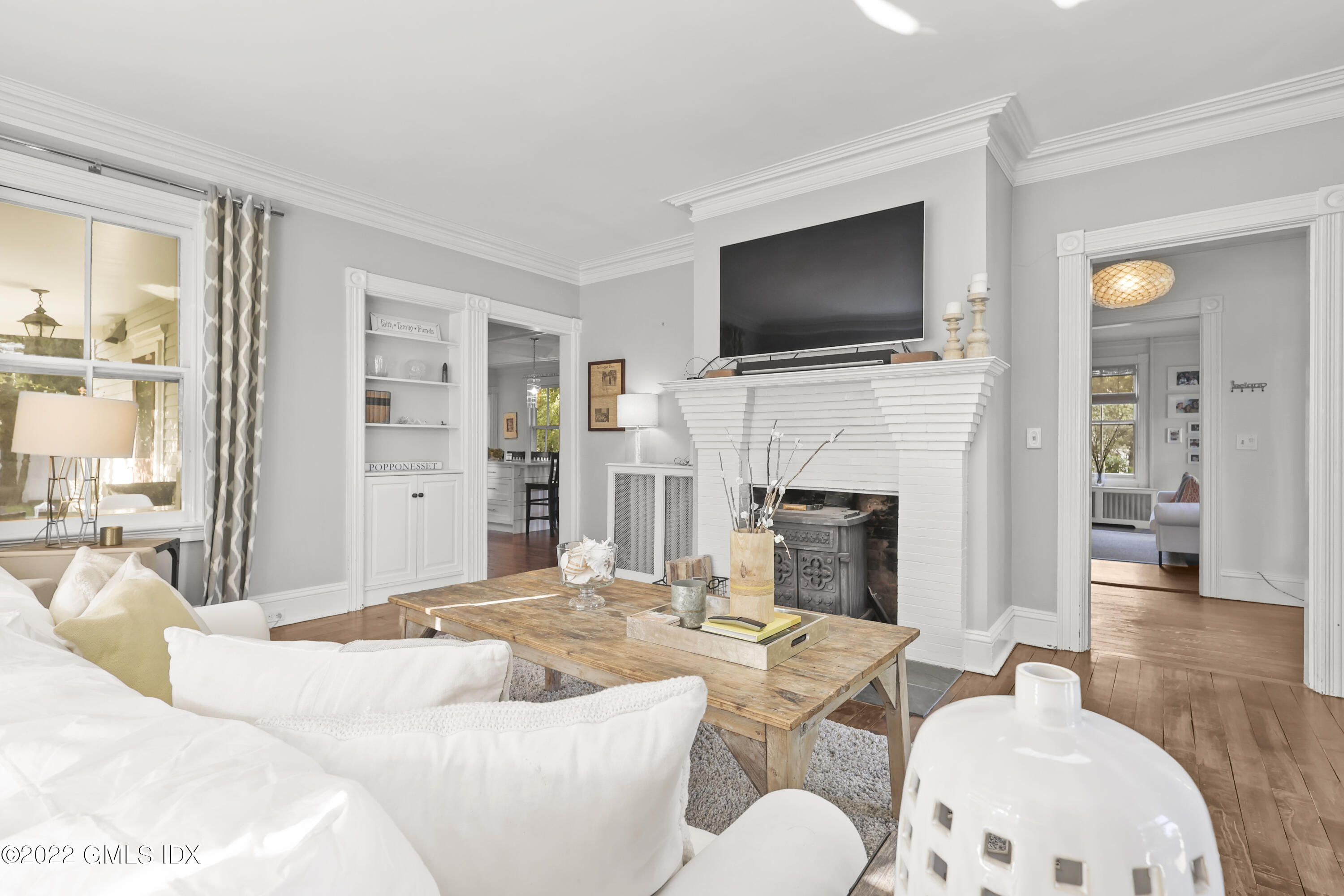 60 River Road Cos Cob, CT 06807 - Photo 5 of 31 a living room with fireplace furniture and a flat screen tv