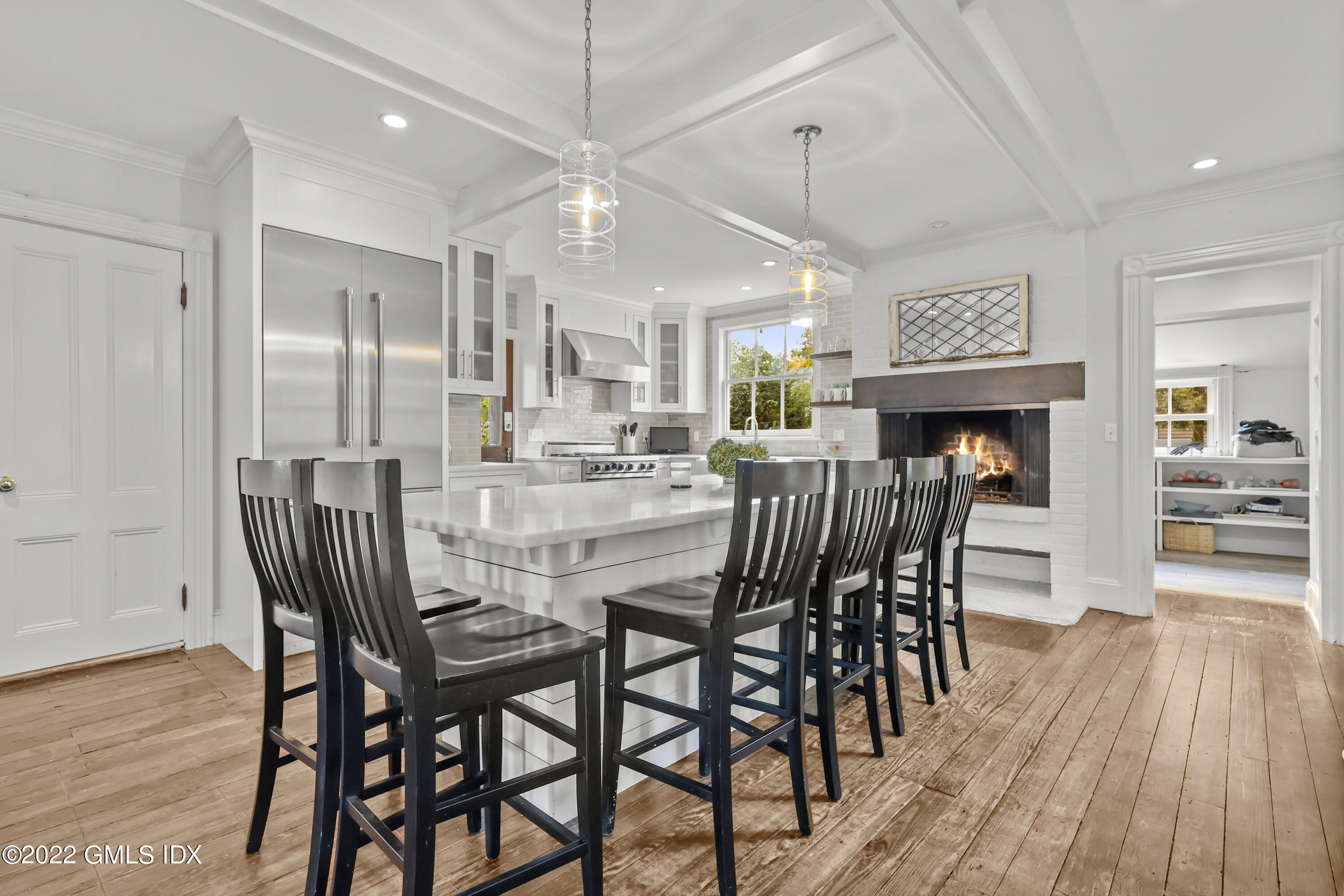 60 River Road Cos Cob, CT 06807 - Photo 9 of 31 a view of a dining area with furniture wooden floor and chandelier
