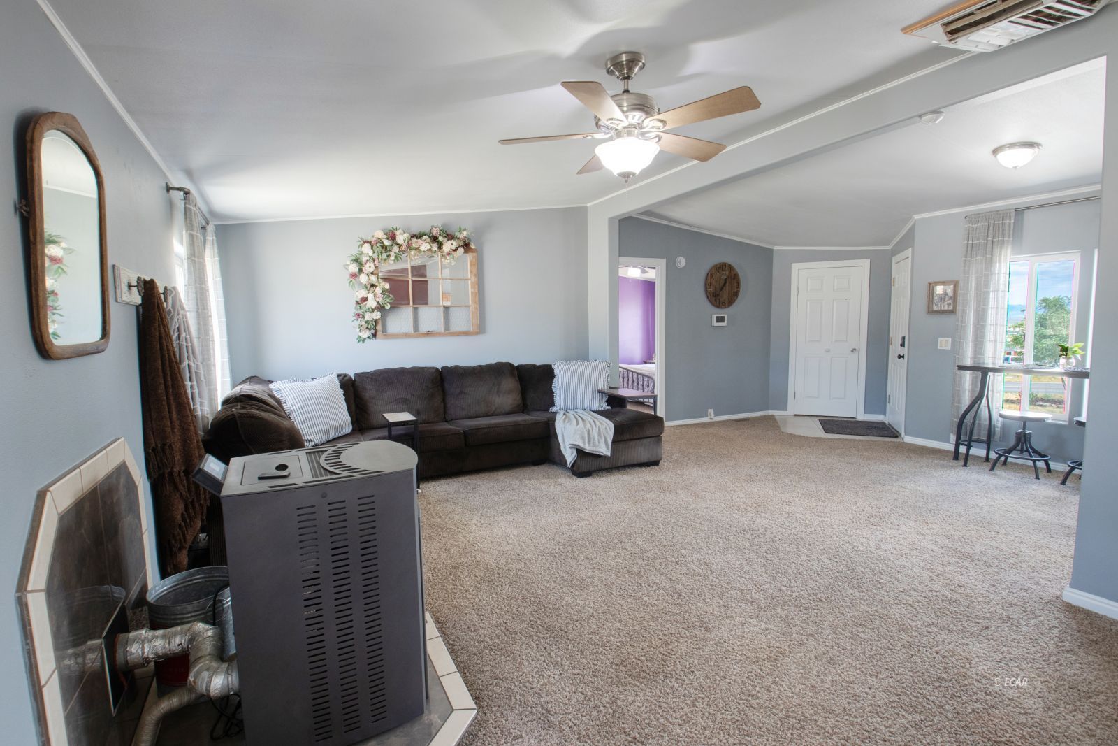 591 Spring Valley Parkway Spring Creek, NV 89815 - Photo 5 of 25 a living room with furniture and a chandelier