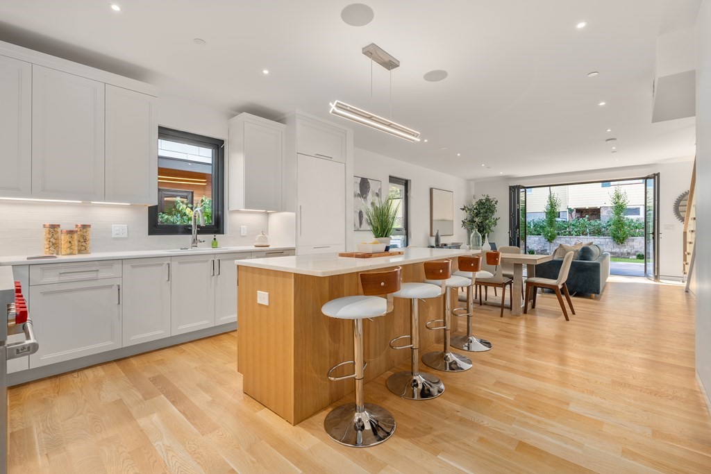 a kitchen with counter top space a sink cabinets and appliances