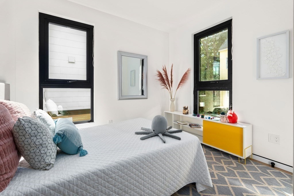 43 Stearns Road, Unit SF Brookline, MA 02446 - Photo 13 of 19 a bedroom with a bed and wooden floor