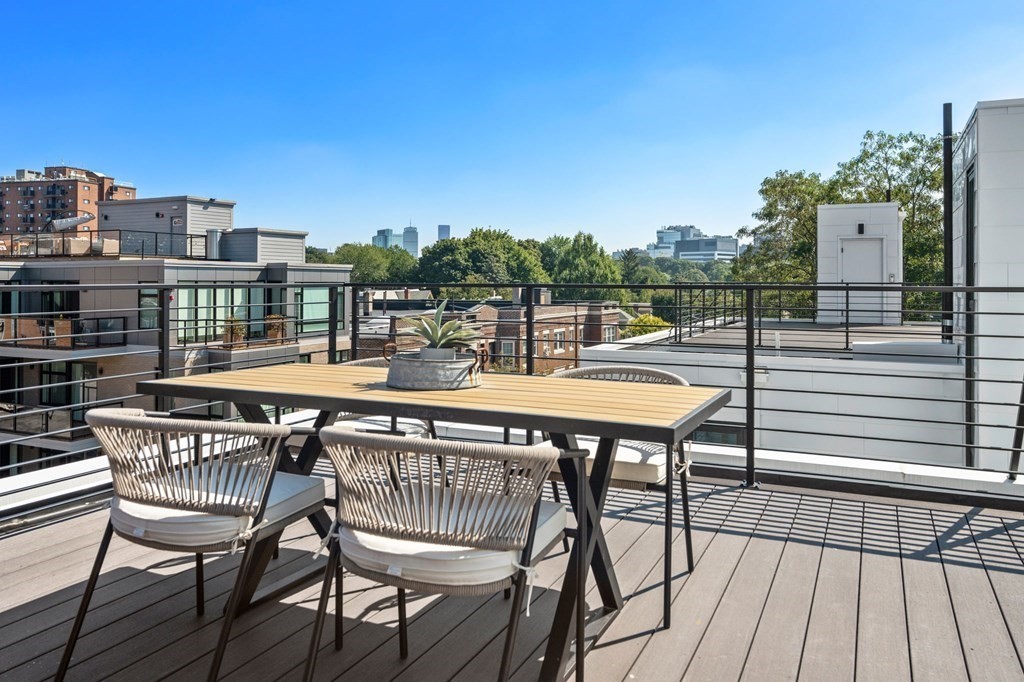 43 Stearns Road, Unit SF Brookline, MA 02446 - Photo 19 of 19 a terrace with outdoor seating and city view