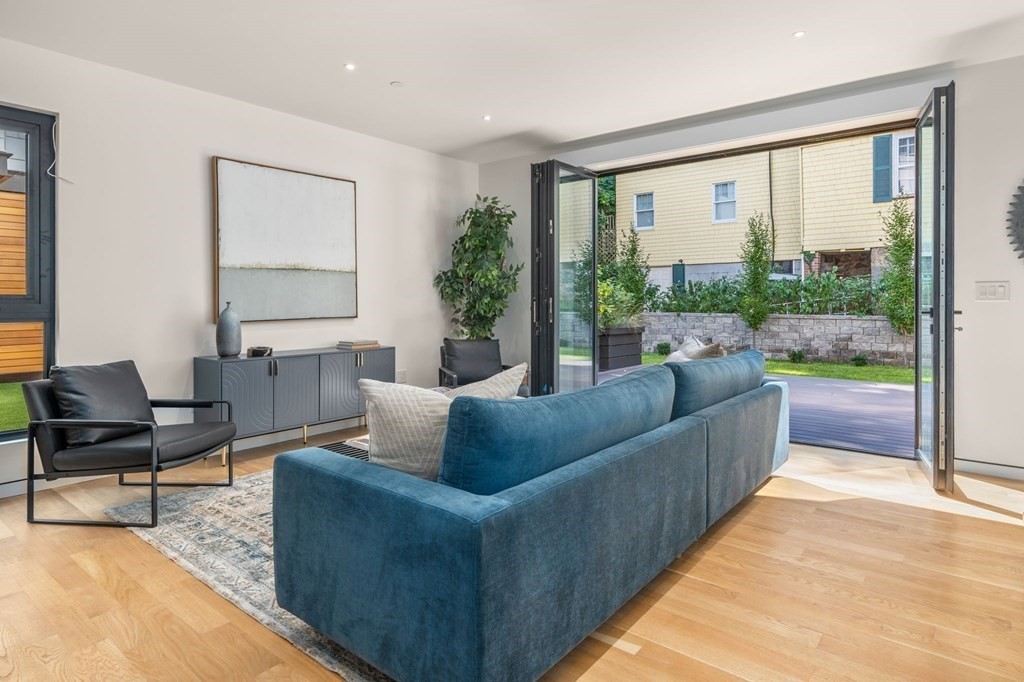 43 Stearns Road, Unit SF Brookline, MA 02446 - Photo 6 of 19 a living room with furniture and a large window