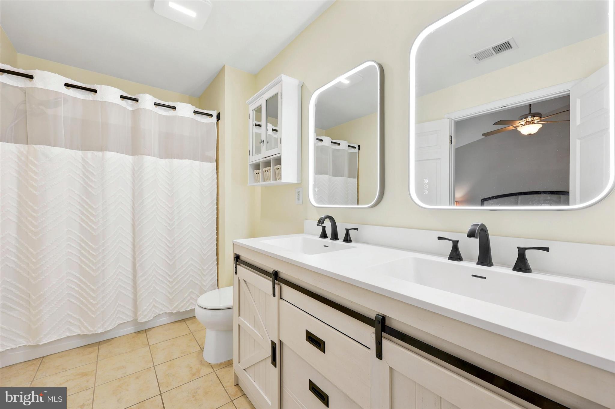 448 Aura Road Glassboro, NJ 08028 - Photo 30 of 33 view of bathroom from walk in closet