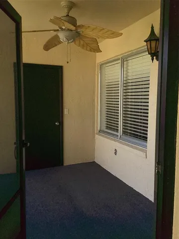 a view of empty room with windows
