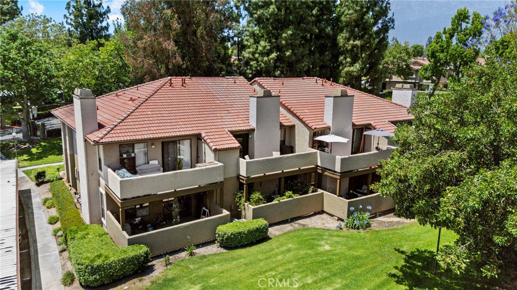 10151 Arrow Route, Unit 6 Rancho Cucamonga, CA 91730 - Photo 3 of 24 aerial view of a house with a yard and sitting area