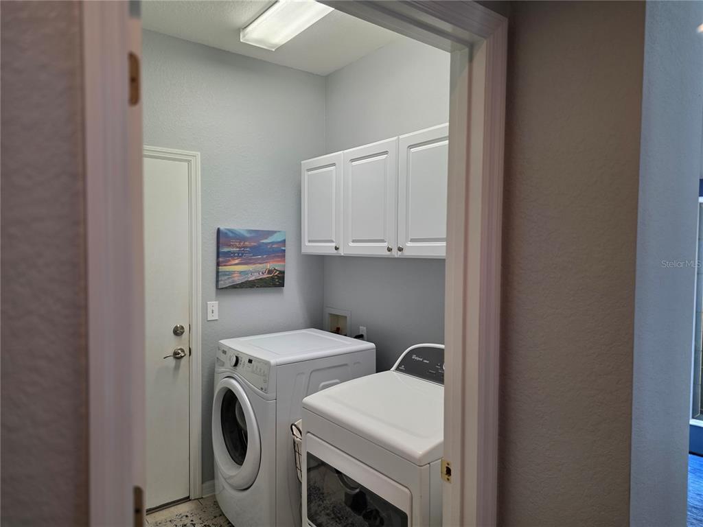 13185 Southeast 93rd Terrace Road Summerfield, FL 34491 - Photo 22 of 48 a utility room with dryer and washer