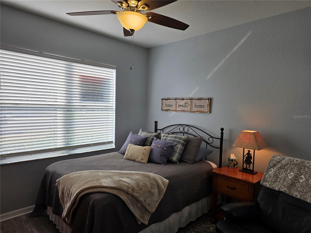 13185 Southeast 93rd Terrace Road Summerfield, FL 34491 - Photo 23 of 48 a bedroom with a bed and a window