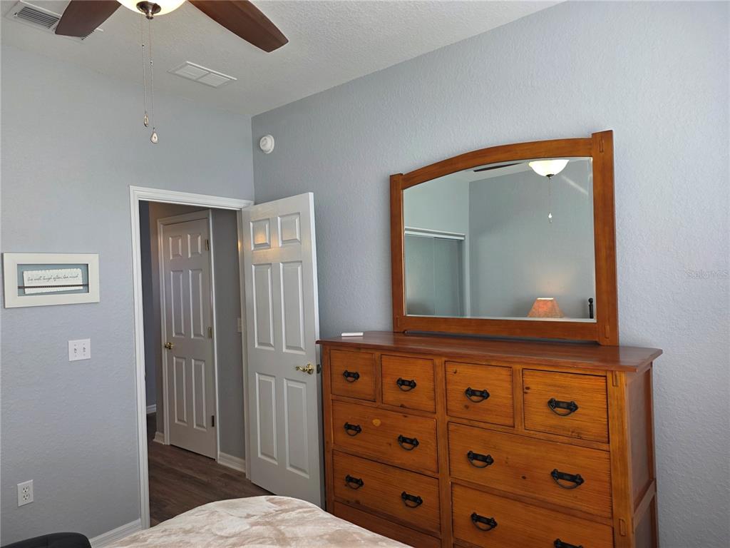 13185 Southeast 93rd Terrace Road Summerfield, FL 34491 - Photo 26 of 48 a bathroom with a sink a mirror and a shower