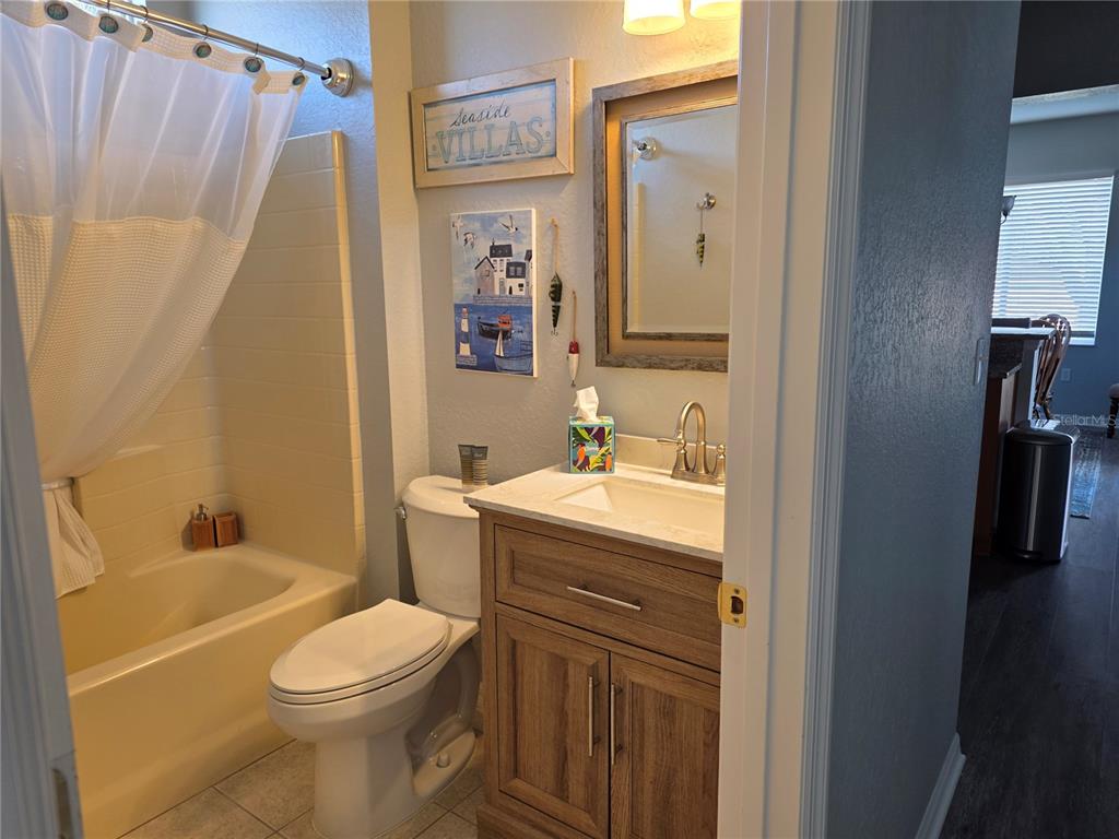 13185 Southeast 93rd Terrace Road Summerfield, FL 34491 - Photo 27 of 48 a bathroom with a sink a toilet and shower