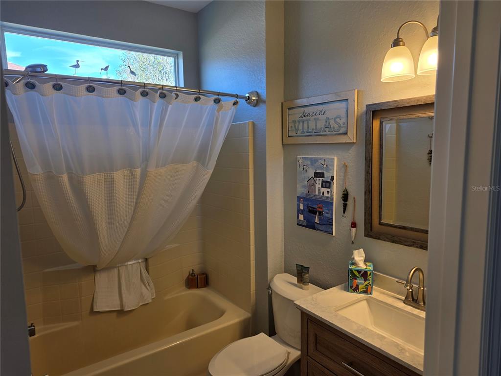 13185 Southeast 93rd Terrace Road Summerfield, FL 34491 - Photo 28 of 48 a bathroom with a sink toilet and shower