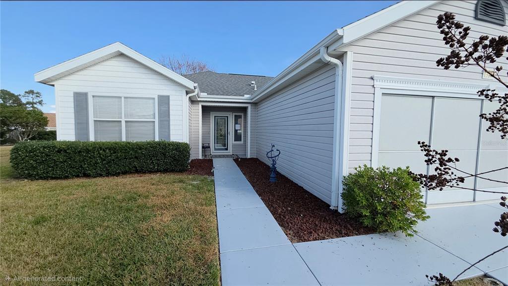 13185 Southeast 93rd Terrace Road Summerfield, FL 34491 - Photo 3 of 48 a front view of a house with garden