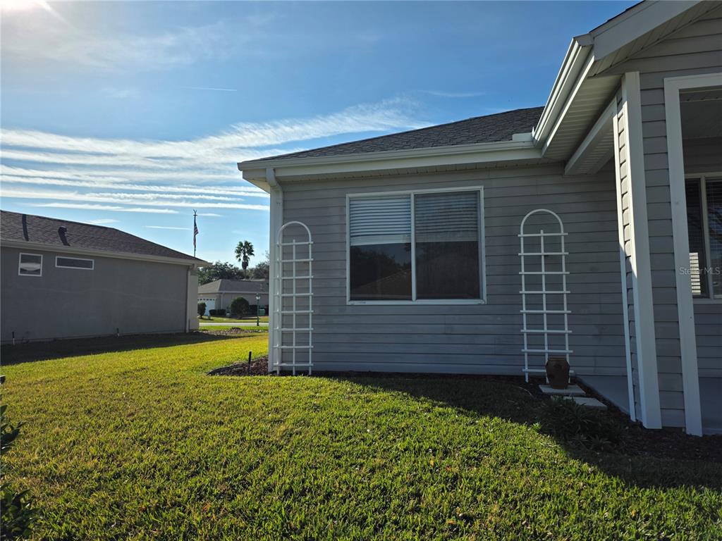 13185 Southeast 93rd Terrace Road Summerfield, FL 34491 - Photo 32 of 48 a view of front door and small yard