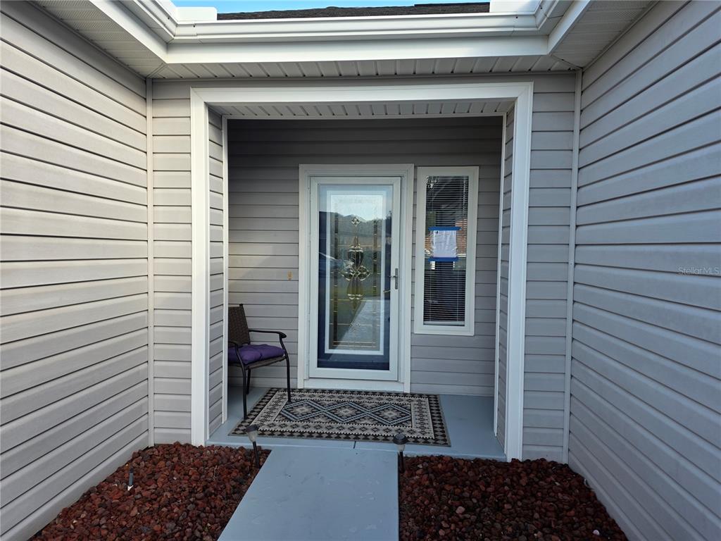 13185 Southeast 93rd Terrace Road Summerfield, FL 34491 - Photo 5 of 48 a view of a door and a window