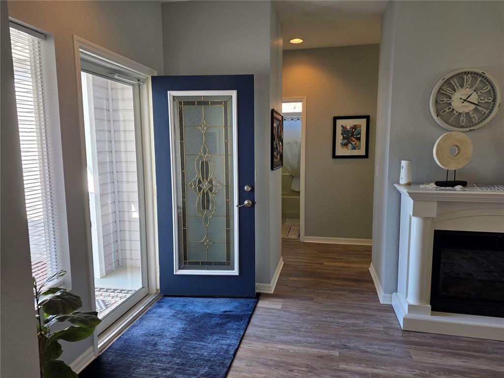 13185 Southeast 93rd Terrace Road Summerfield, FL 34491 - Photo 6 of 48 a view of an entryway with wooden floor