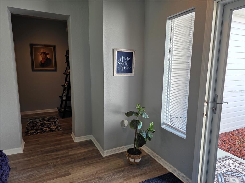 13185 Southeast 93rd Terrace Road Summerfield, FL 34491 - Photo 7 of 48 a view of an entryway with wooden floor