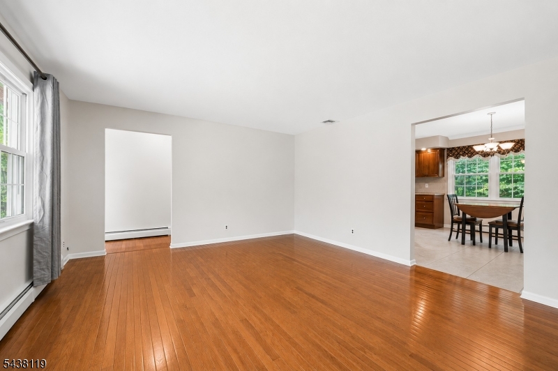 335 Drakestown Road Long Valley, NJ 07853 - Photo 6 of 34 a view of an empty room with window and wooden floor