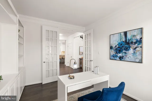 a view of a patio with a table and chairs