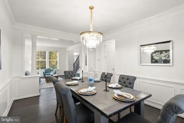 a front view of a house with a yard and outdoor seating