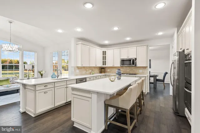 a spacious bedroom with a bed and windows