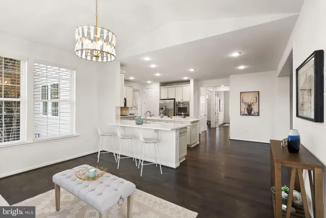 a living room with furniture rug and window