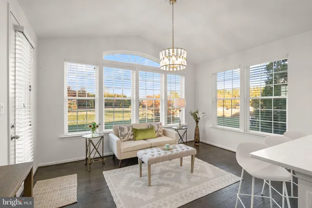 a living room with furniture or couch and a window