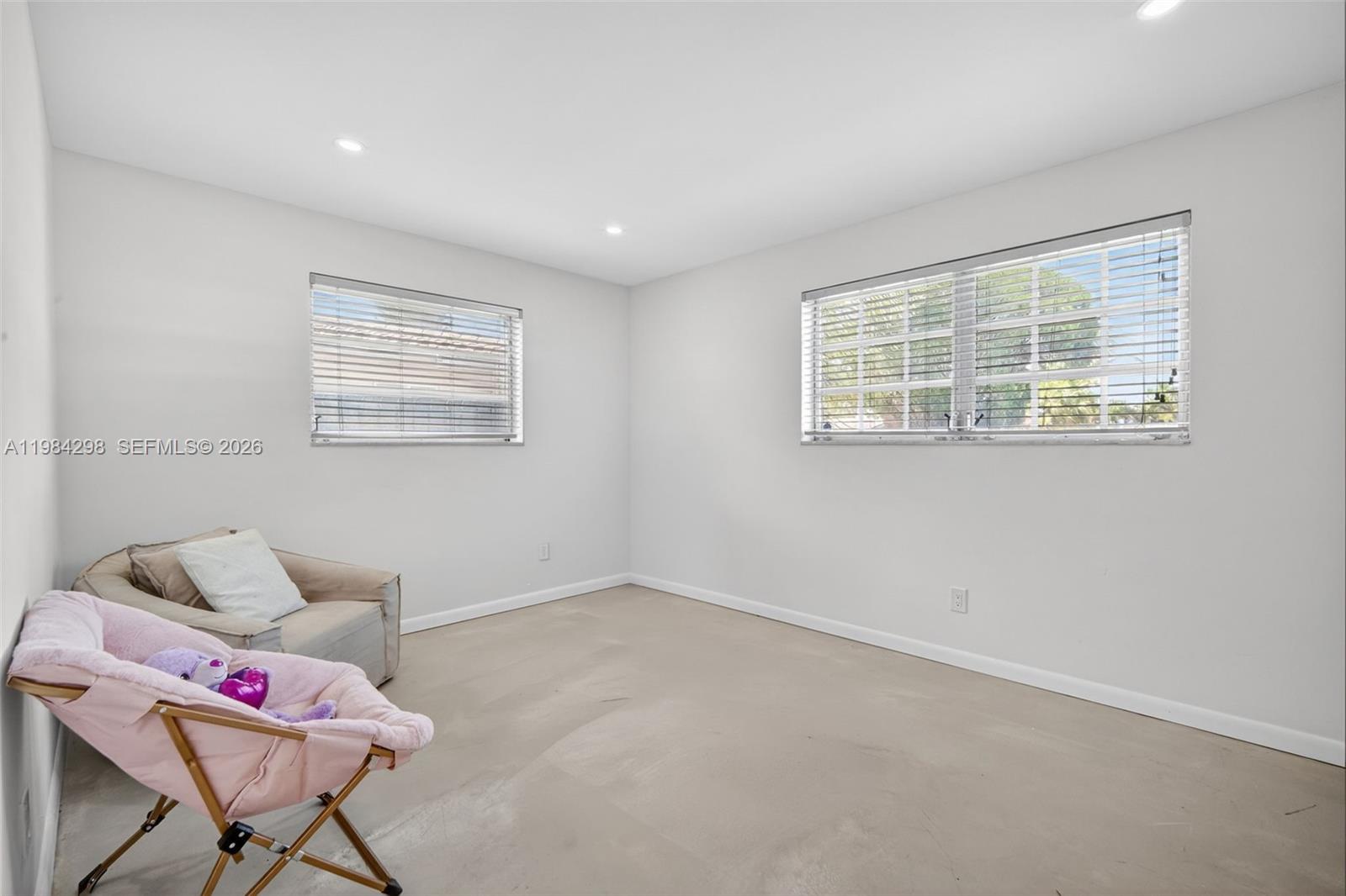 1119 North 46th Terrace Hollywood, FL 33021 - Photo 22 of 41 a living room with furniture and a window