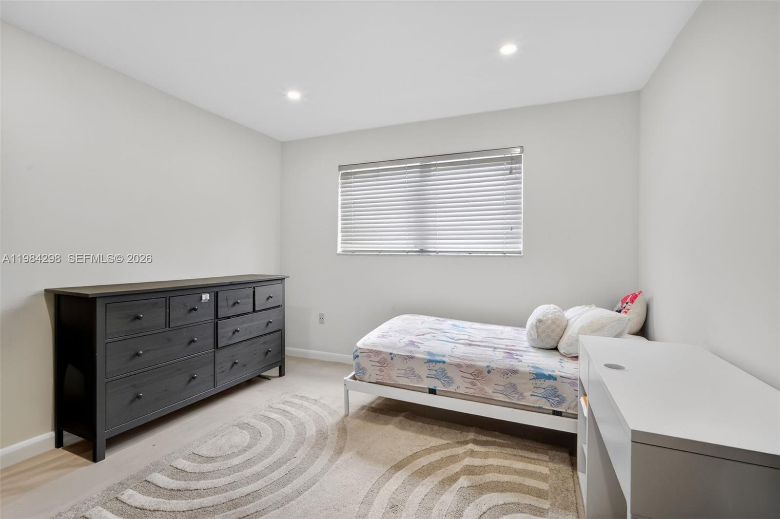 1119 North 46th Terrace Hollywood, FL 33021 - Photo 26 of 41 a bedroom with a bed and a window