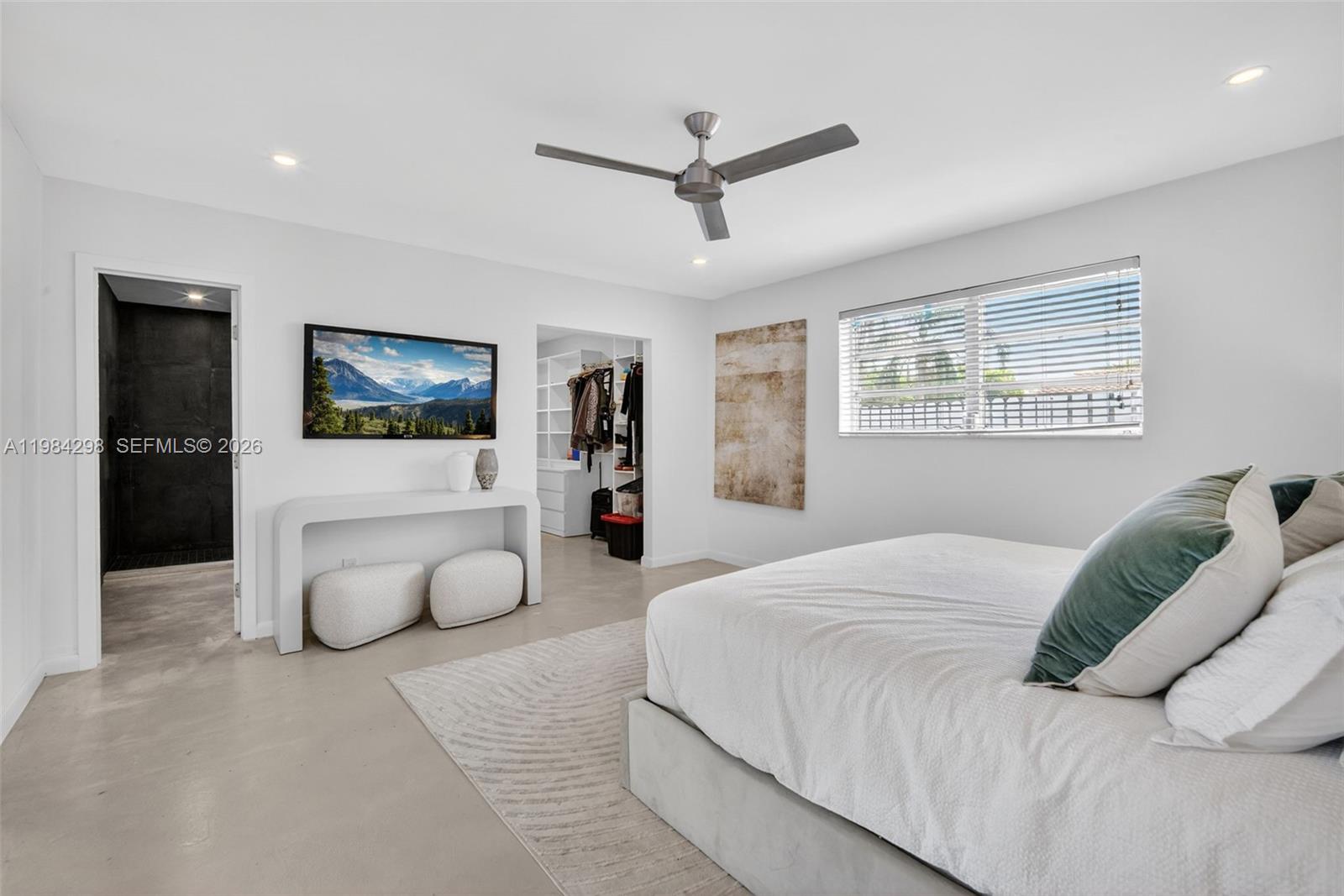1119 North 46th Terrace Hollywood, FL 33021 - Photo 28 of 41 a bedroom with a large bed and a window