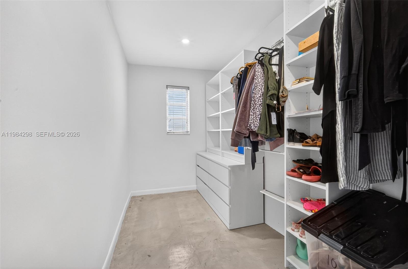 1119 North 46th Terrace Hollywood, FL 33021 - Photo 30 of 41 a view of walk in closet with clothes and shoes
