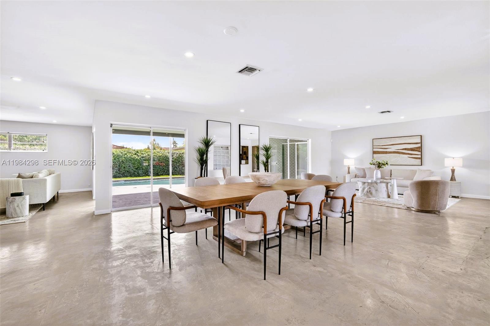 1119 North 46th Terrace Hollywood, FL 33021 - Photo 3 of 41 a view of a dining room with furniture and a livingroom
