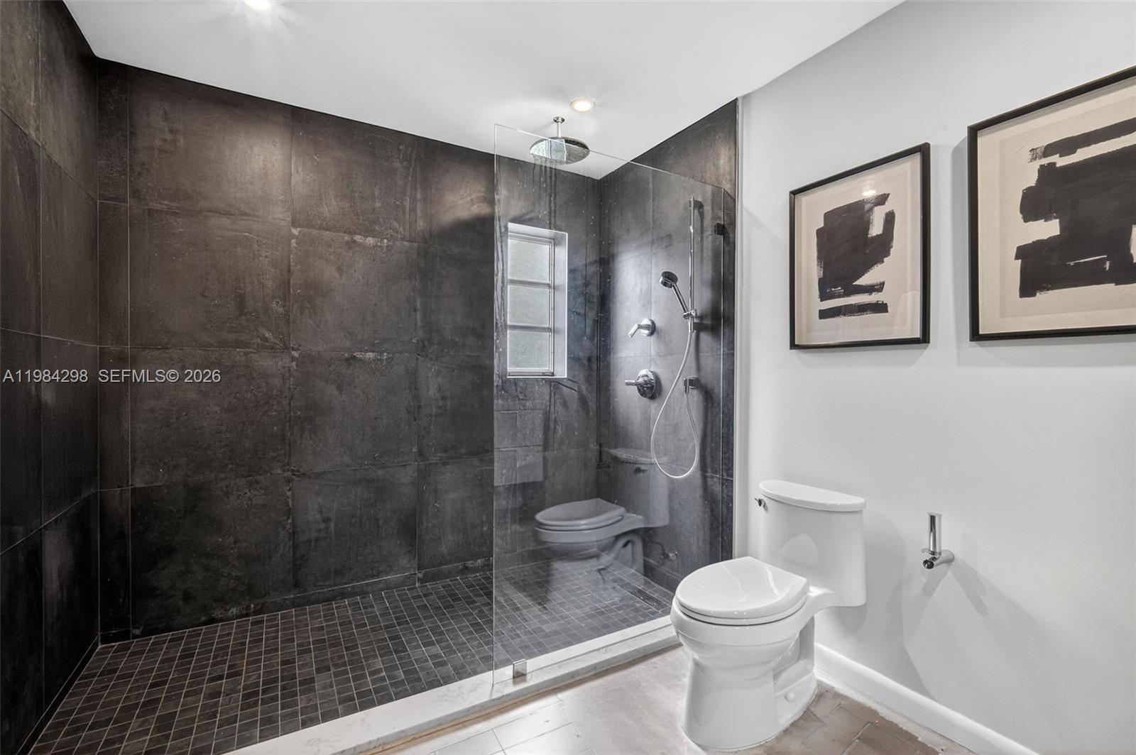 1119 North 46th Terrace Hollywood, FL 33021 - Photo 32 of 41 a bathroom with a toilet and a shower