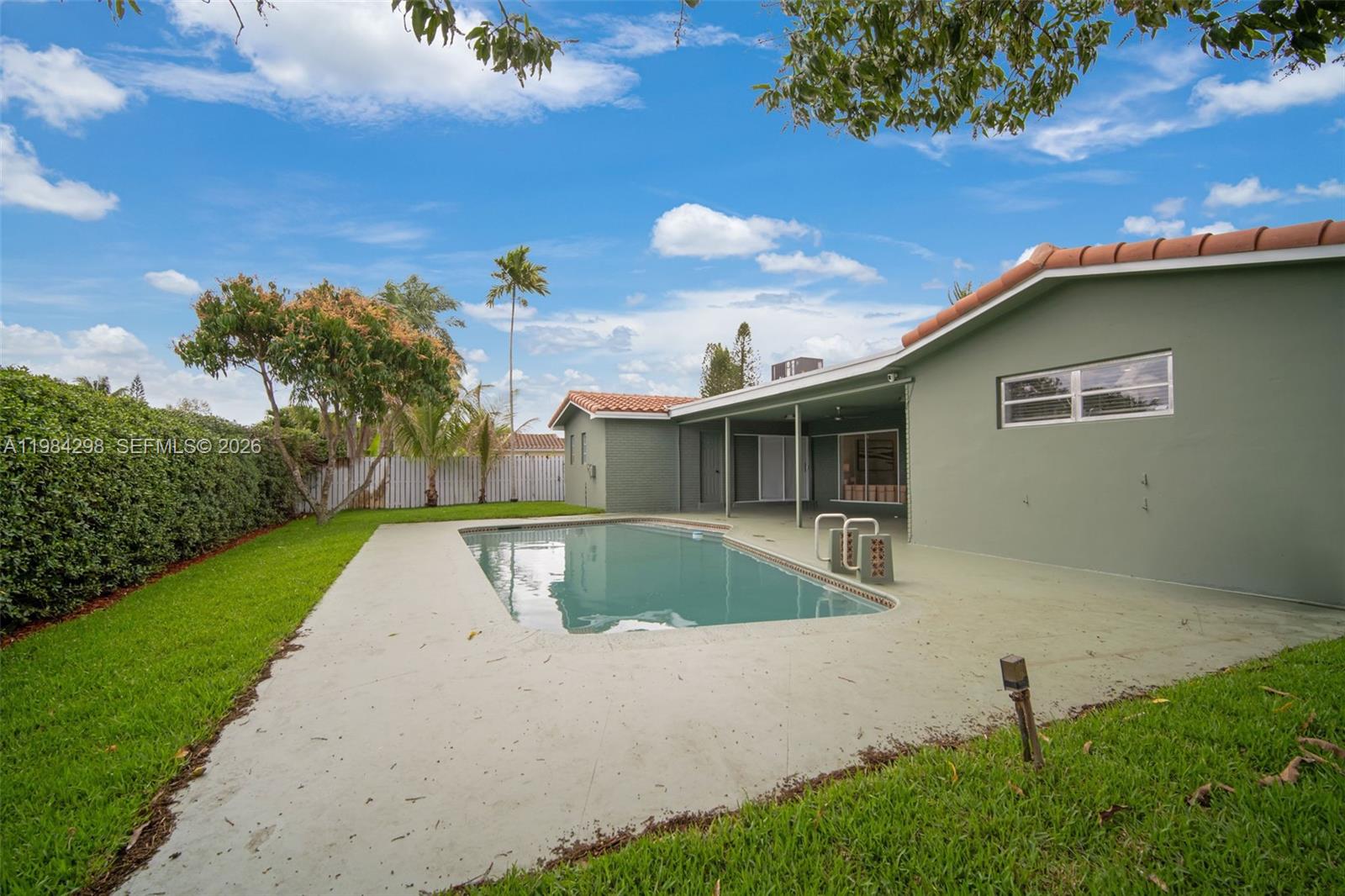 1119 North 46th Terrace Hollywood, FL 33021 - Photo 39 of 41 a view of a backyard with a garden and plants