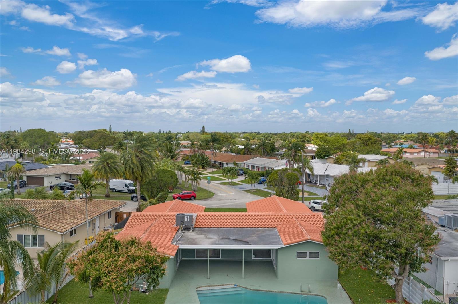 1119 North 46th Terrace Hollywood, FL 33021 - Photo 41 of 41 a view of a lake with outdoor space yard kitchen and mountain view in back