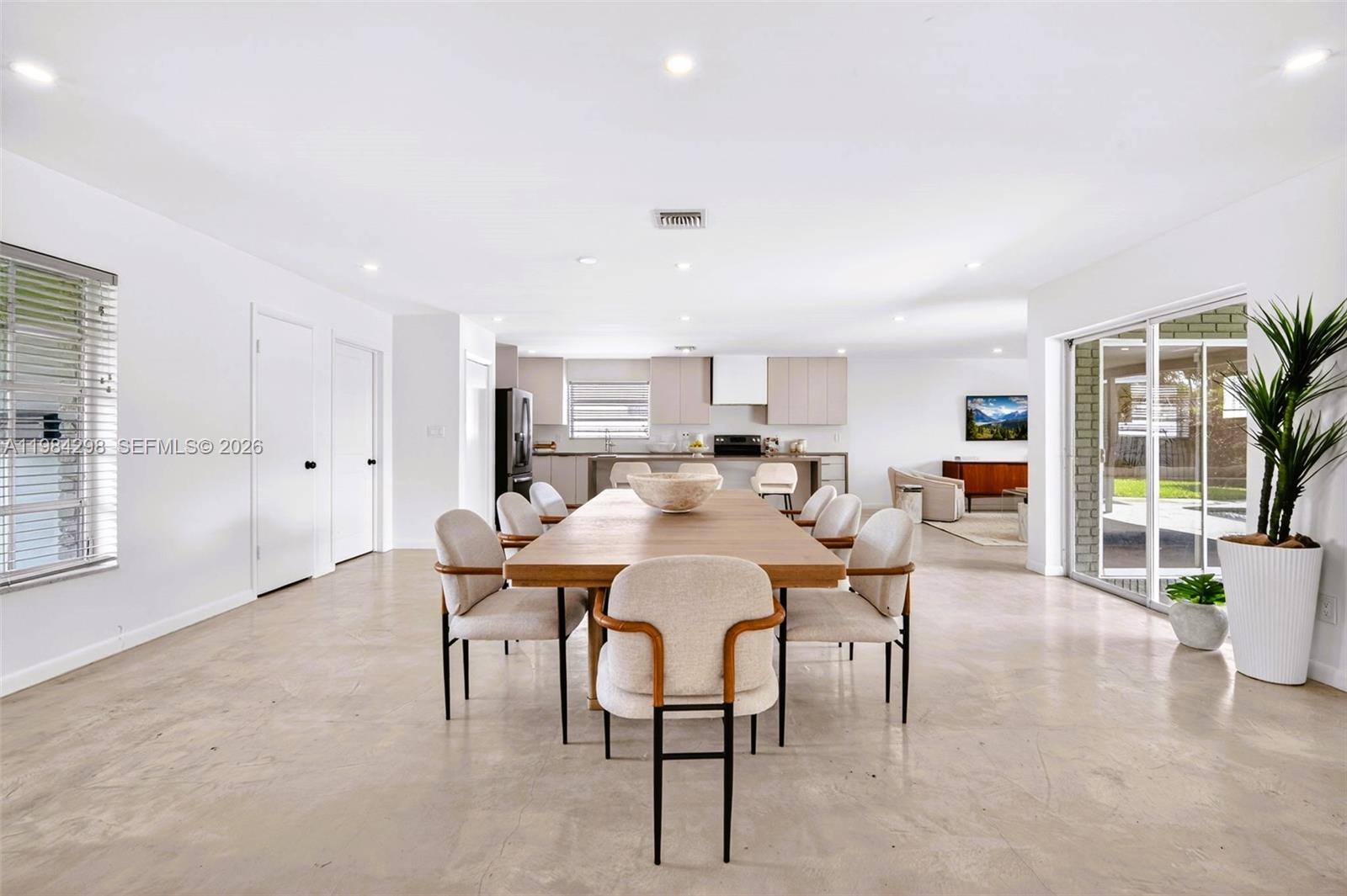 1119 North 46th Terrace Hollywood, FL 33021 - Photo 10 of 41 a view of a dining room with furniture and wooden floor