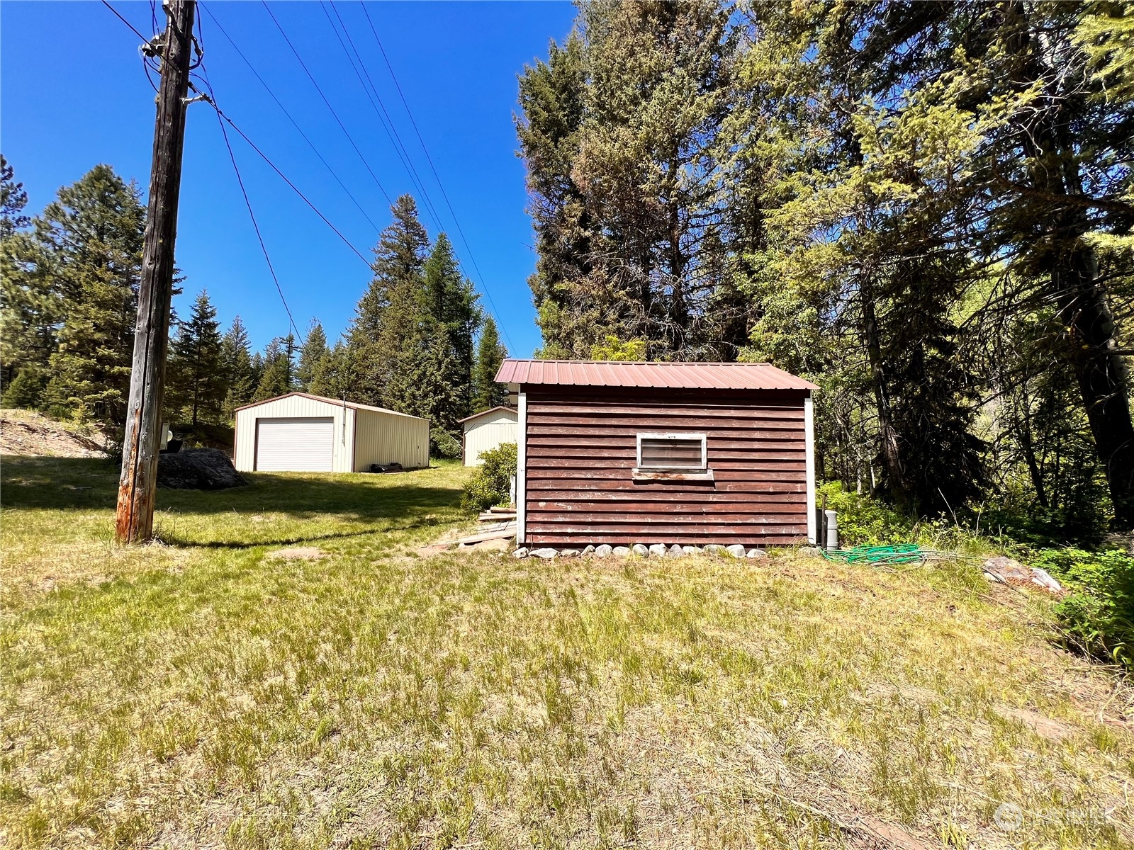 29795 State Rte 20 Republic, WA 99166 - Photo 17 of 30 a view of a house with a yard and garage