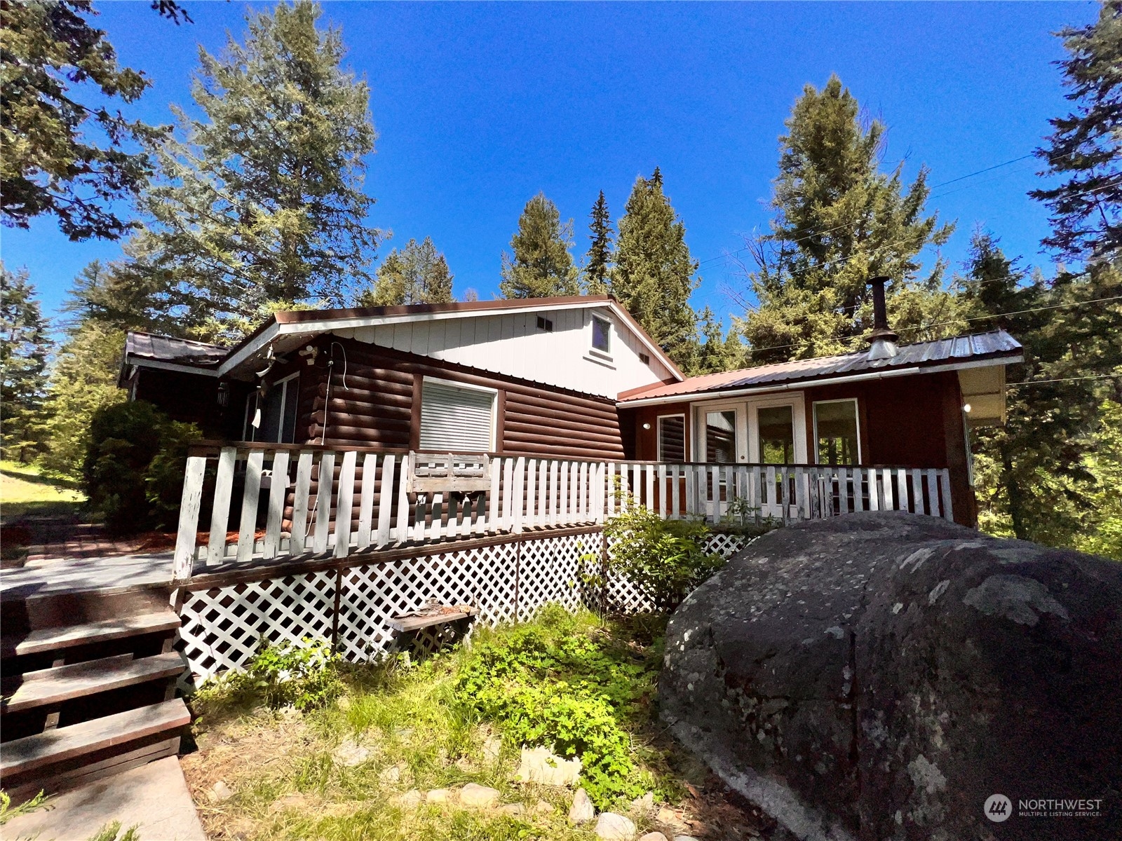 29795 State Rte 20 Republic, WA 99166 - Photo 25 of 30 a front view of a house with a garden