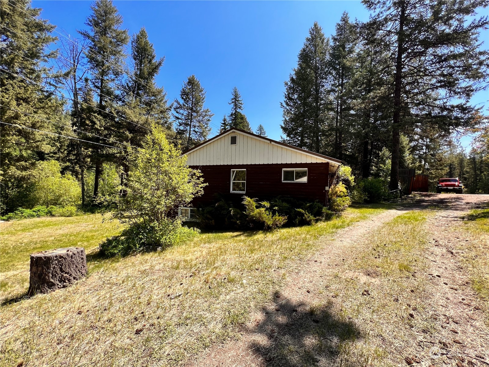 29795 State Rte 20 Republic, WA 99166 - Photo 29 of 30 a view of a house with a yard covered with snow in the background