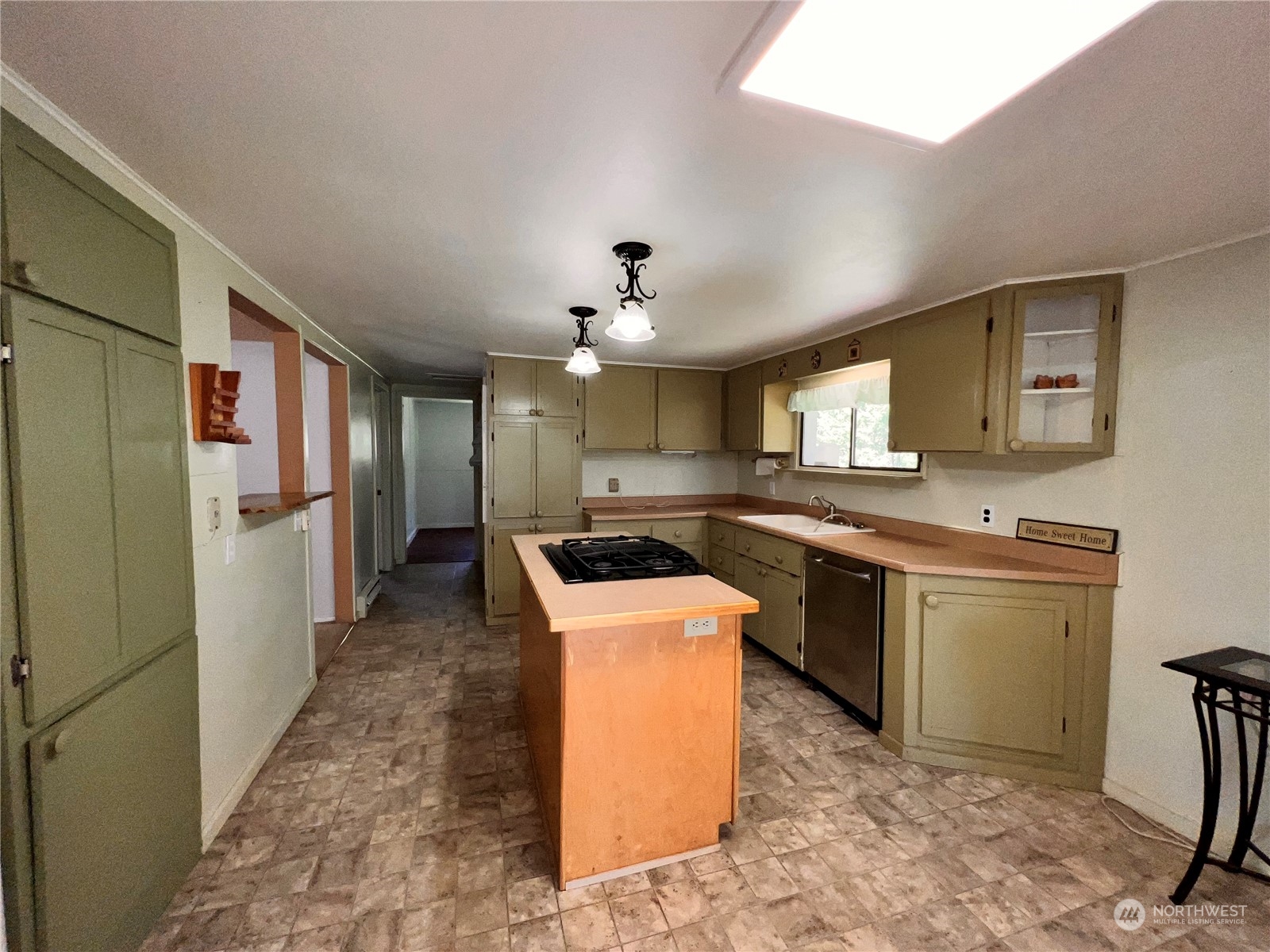 29795 State Rte 20 Republic, WA 99166 - Photo 5 of 30 a kitchen with a sink stove and refrigerator
