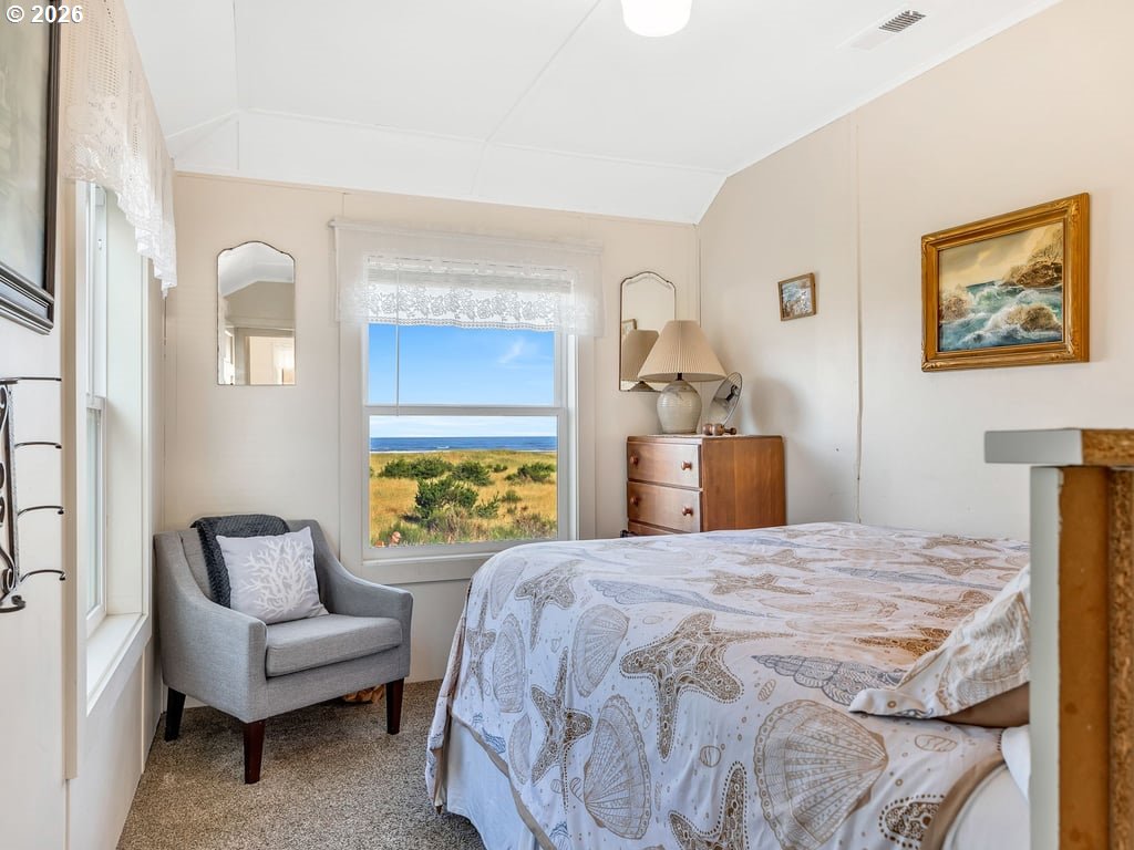 1081 South Promenade Seaside, OR 97138 - Photo 21 of 39 a bedroom with a bed couch and a window