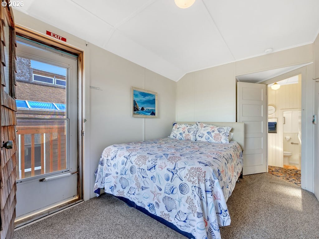 1081 South Promenade Seaside, OR 97138 - Photo 23 of 39 a bedroom with a bed and a painting on the wall