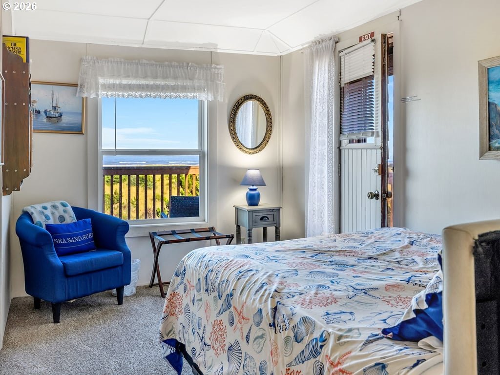 1081 South Promenade Seaside, OR 97138 - Photo 24 of 39 a bedroom with a bed couch and a window